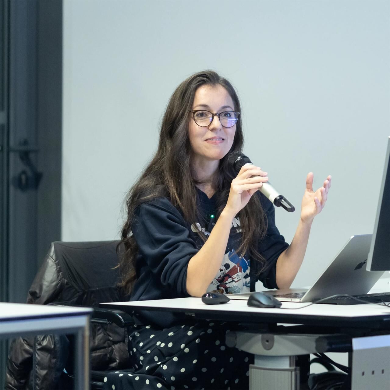 Andra Matresu speaking at a training session